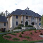 A large house with a lot of landscaping around it