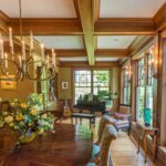 A dining room with wooden floors and walls.