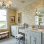 A bathroom with two sinks and a large mirror.