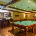 A pool table in the middle of a room.