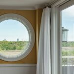 A round window in the wall of a room.