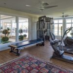 A gym with many different equipment in it