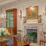 A dining room with a fireplace and a table