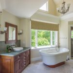 A bathroom with a large tub and sink.