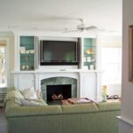 A living room with a couch and fireplace