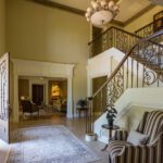 A living room with stairs and a couch