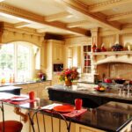 A kitchen with a table and chairs in it