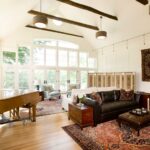 A living room with a piano and couch