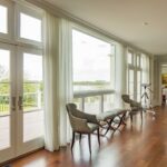 A large open living room with lots of windows.