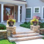 A house with steps leading to the front door.