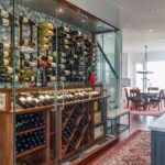 A wine cellar with many bottles of wine on display.