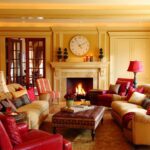 A living room with couches, chairs and a fire place.