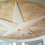 A ceiling with a star painted on it